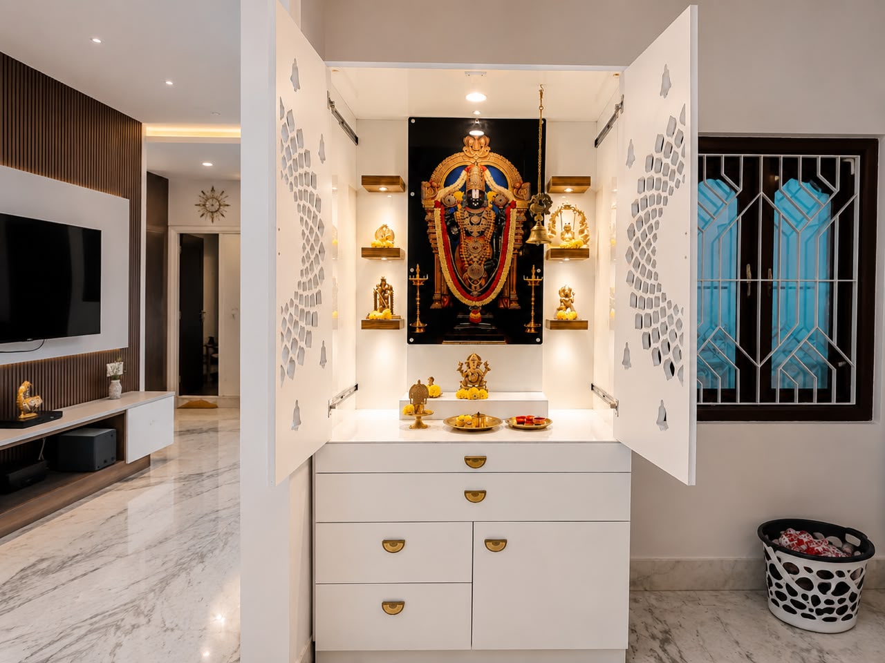 White and gold pooja unit with backlit jaali shutters